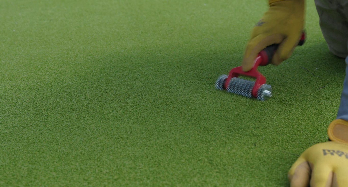 Landscaper maintaining garden beds with fresh mulch in Daly City, CA